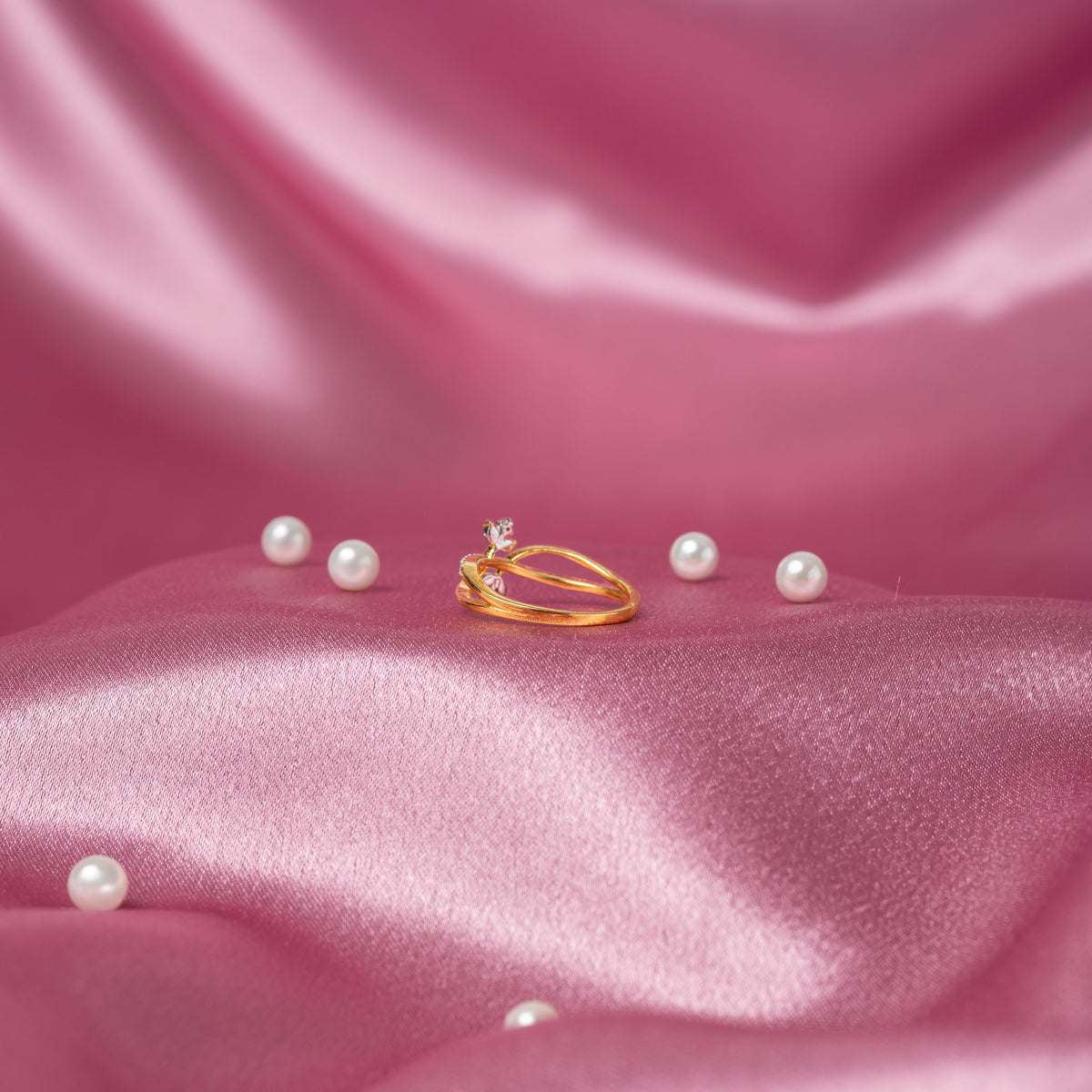 Close crop of the white CZ petals set flush with the narrow sterling silver band