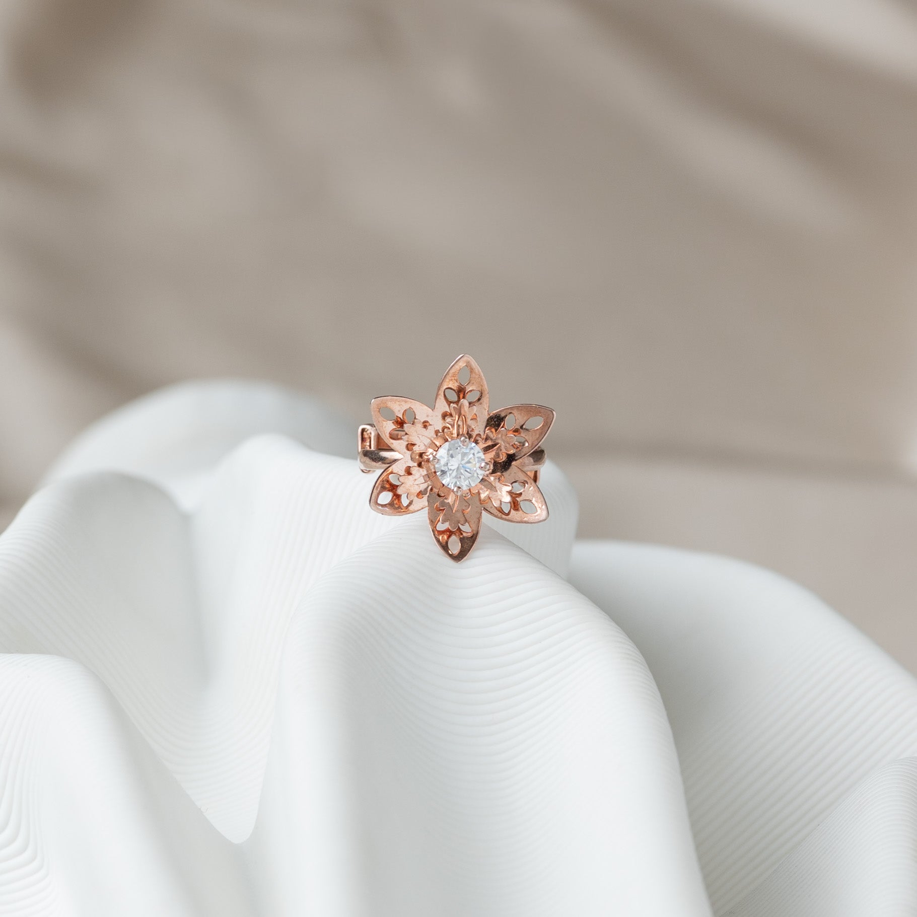 Six petal jaali flower ring with a round CZ centre in rose gold plated 925 silver