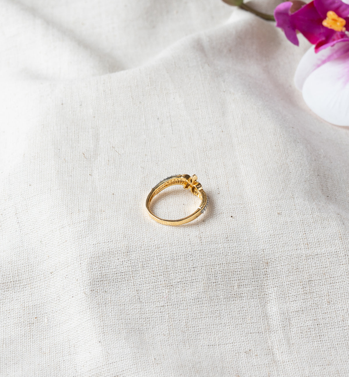 Rear view of the ring showing the plain band behind the floral motif in gold plated 925 silver