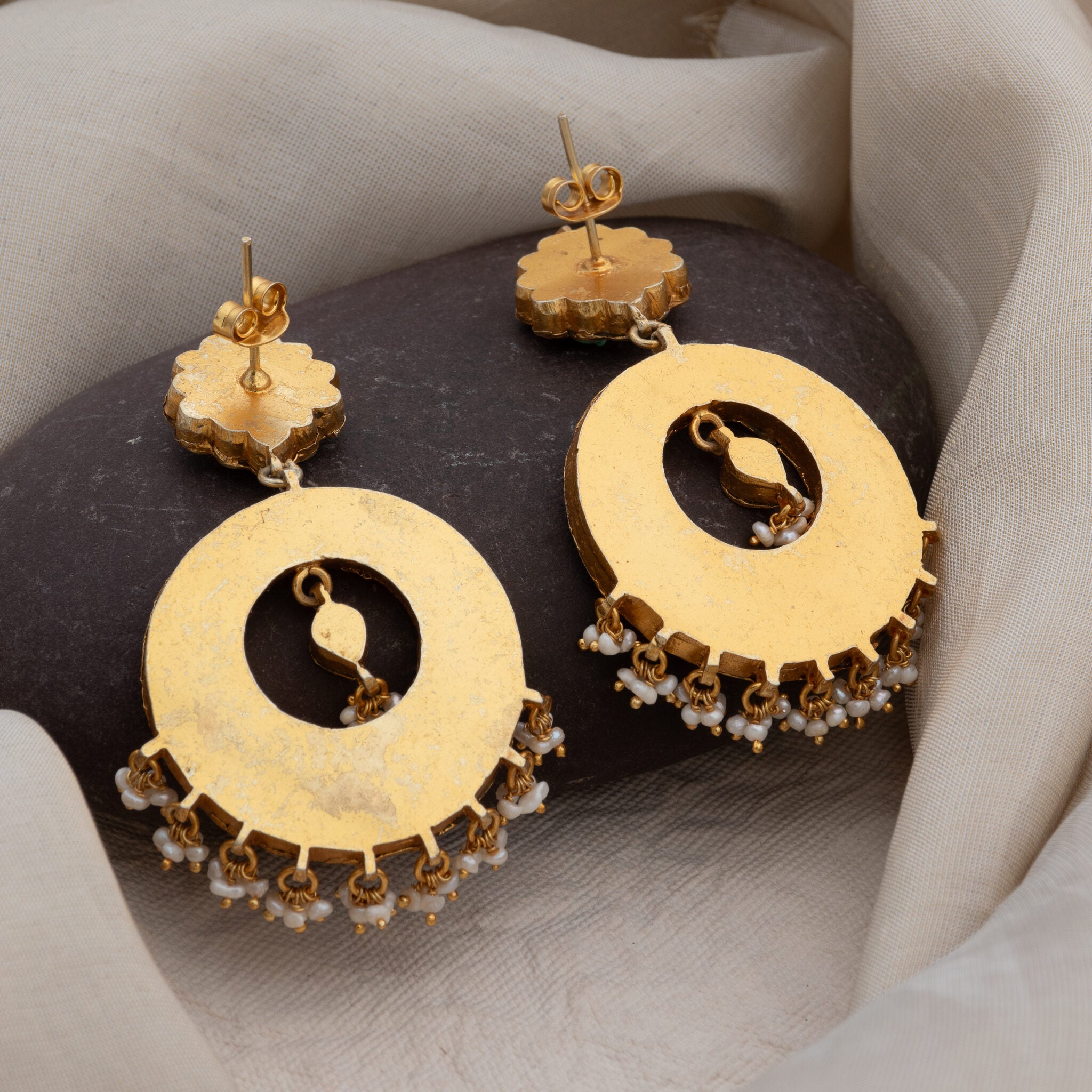Back of the chand bali showing the plain gold plated plate with the post and push back fitting