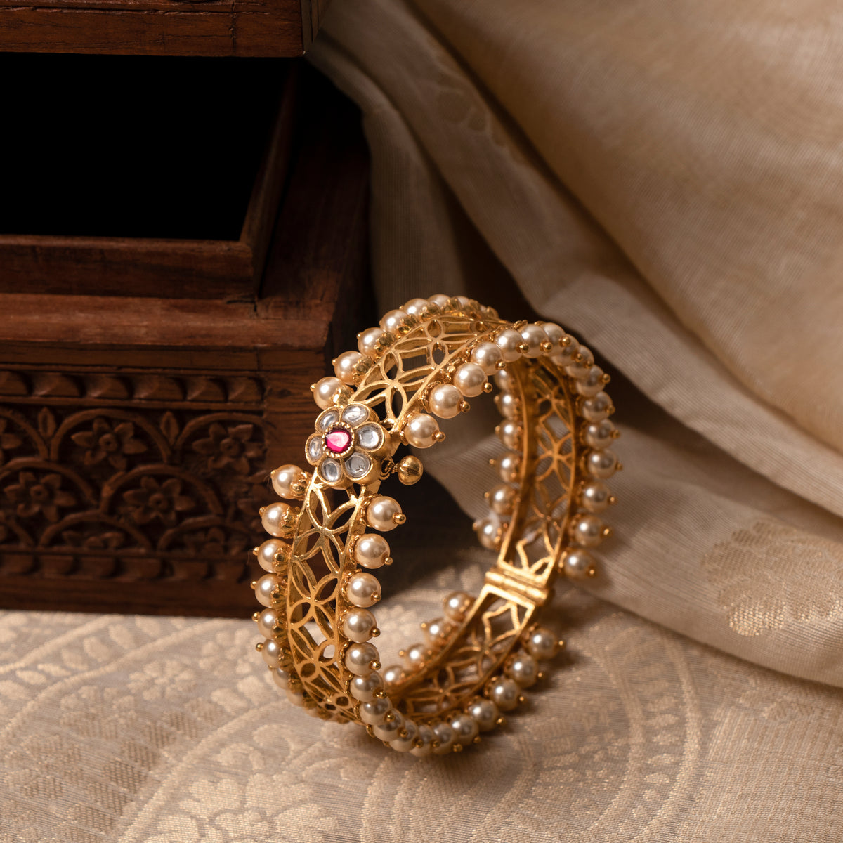 Jaali kada in gold plated 925 silver with white kundan flower, red centre and seed pearl rims