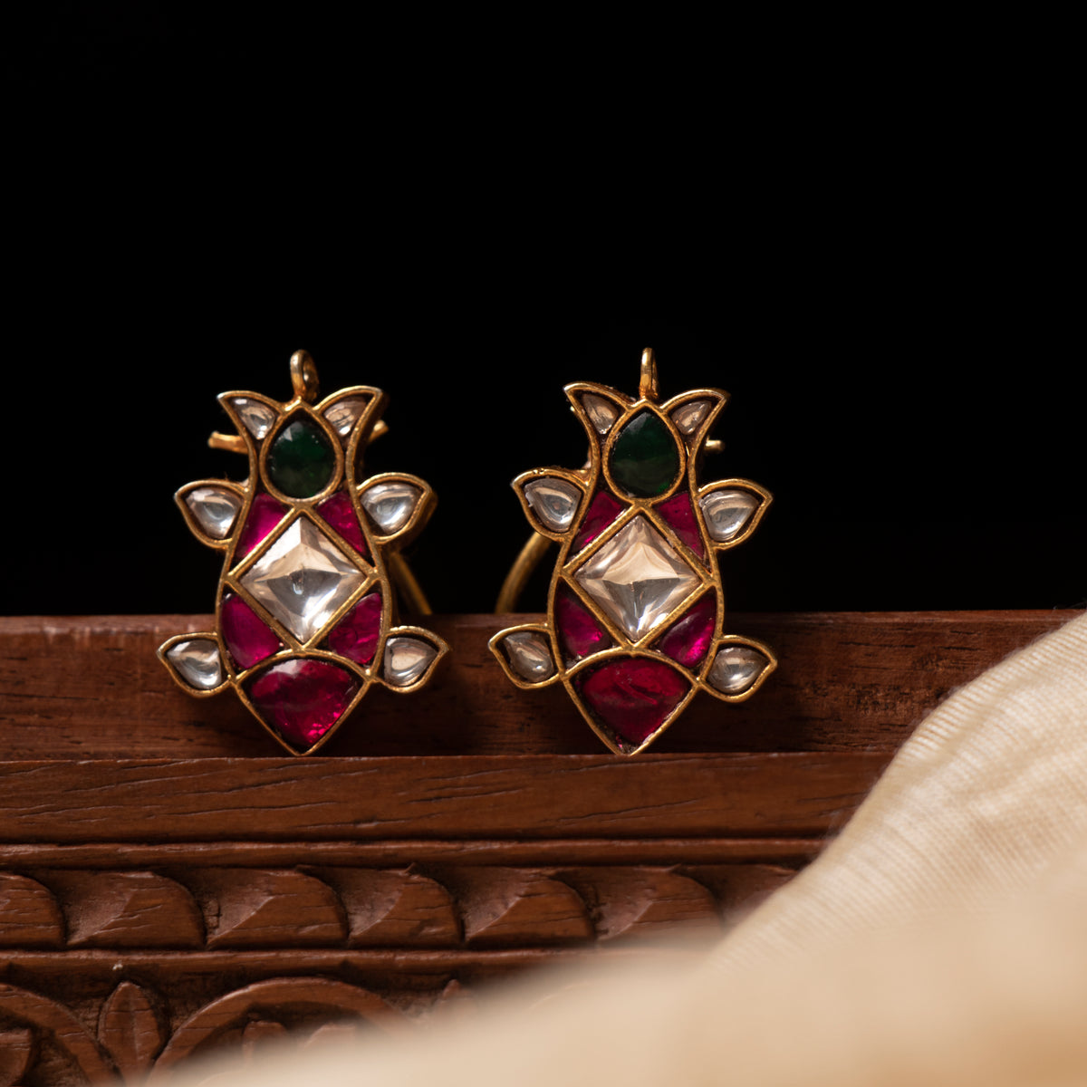 Lotus bud studs with square white kundan, pink-red surround and green pear top, gold plated