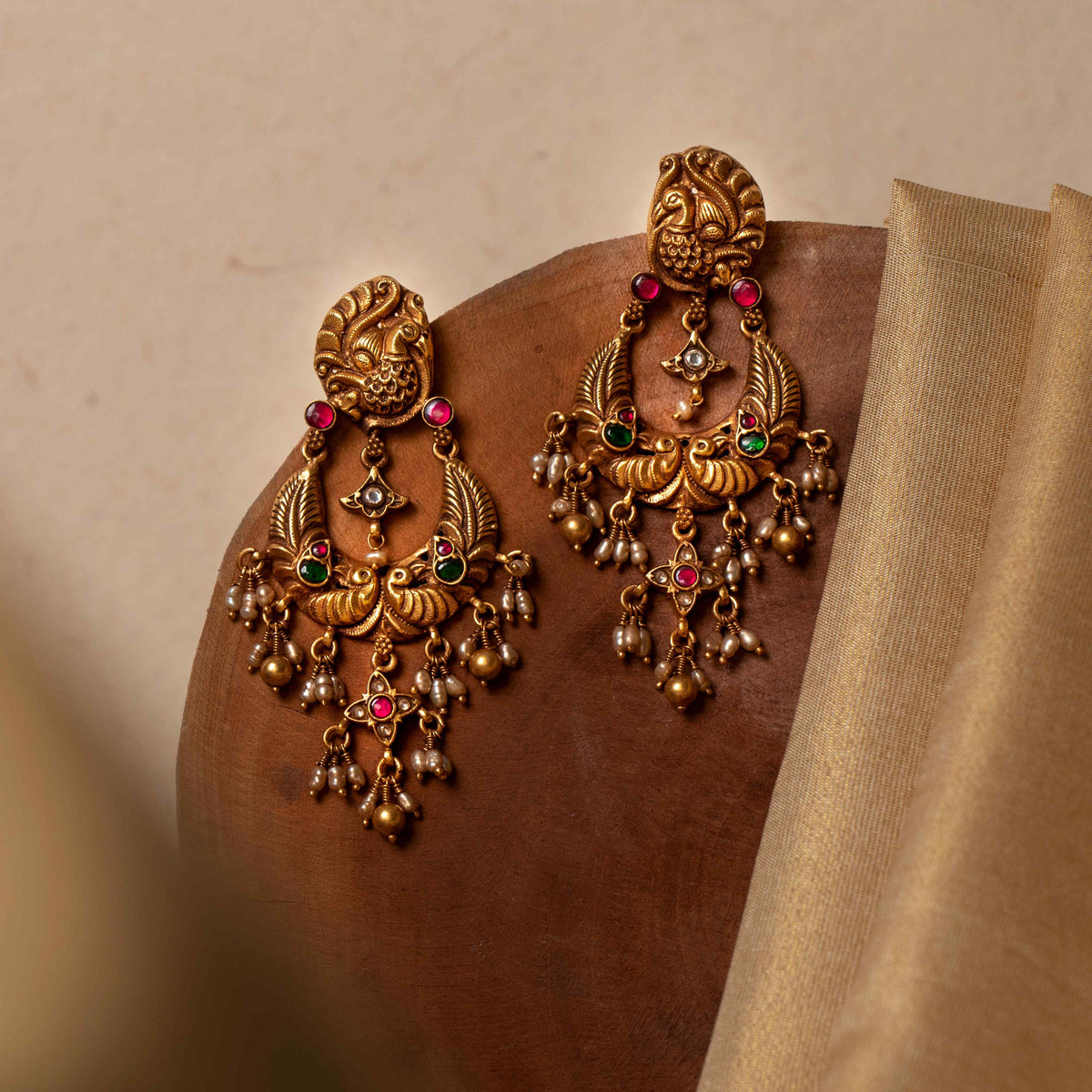  Seed pearls and gold beads fringing the carved crescent, angled view in antique gold