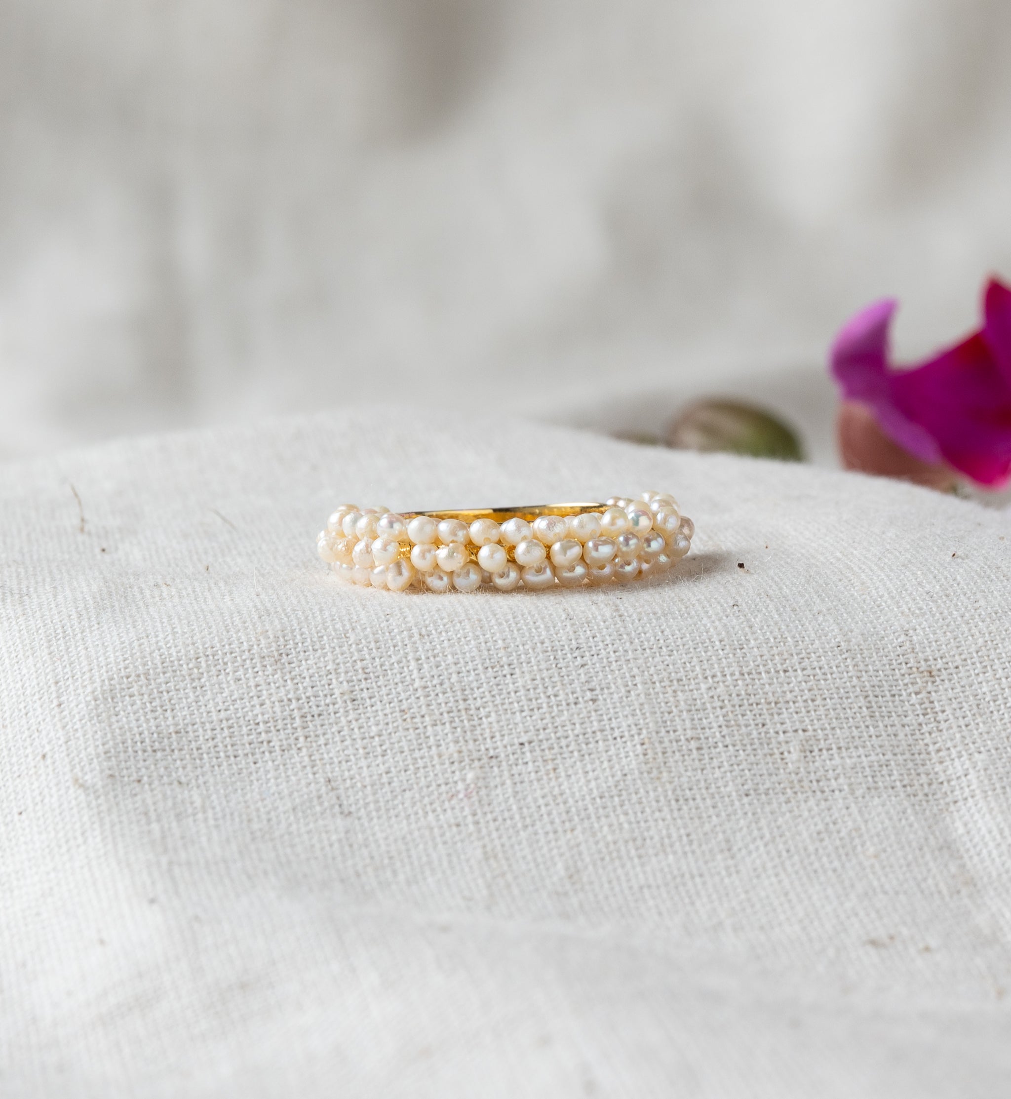 Side profile of the pearl cluster band showing rows of freshwater pearls over gold plated silver