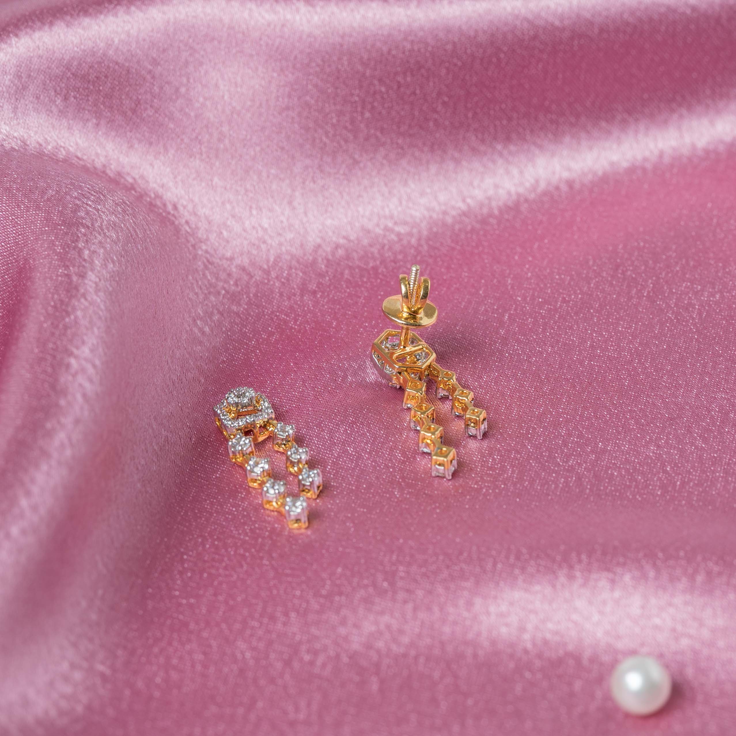Hexagonal stud earrings with CZ paved drop chains in gold plated 925 silver beside the matching necklace
