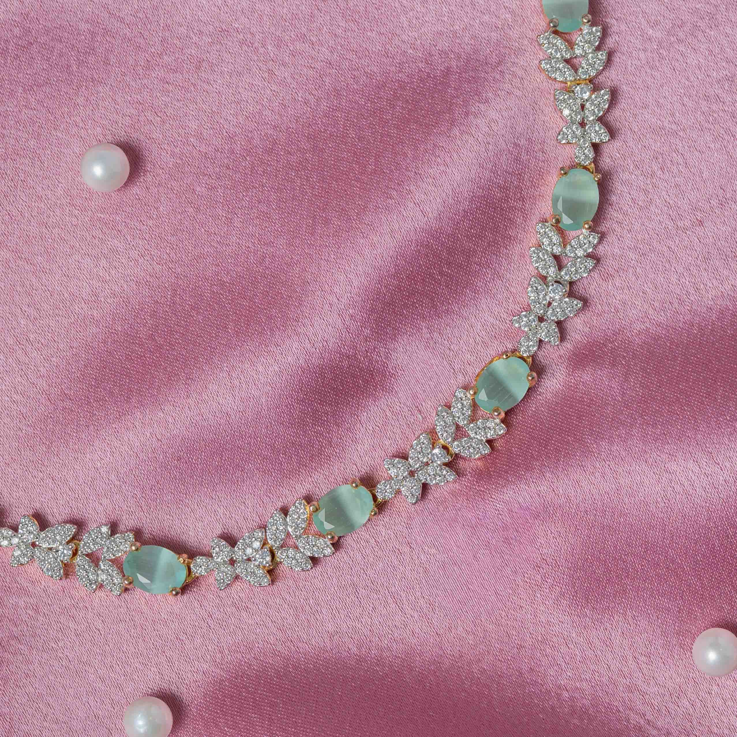 Close-up of Rovia CZ necklace featuring oval green onyx stones, leaf-inspired CZ motifs and handcrafted 925 silver