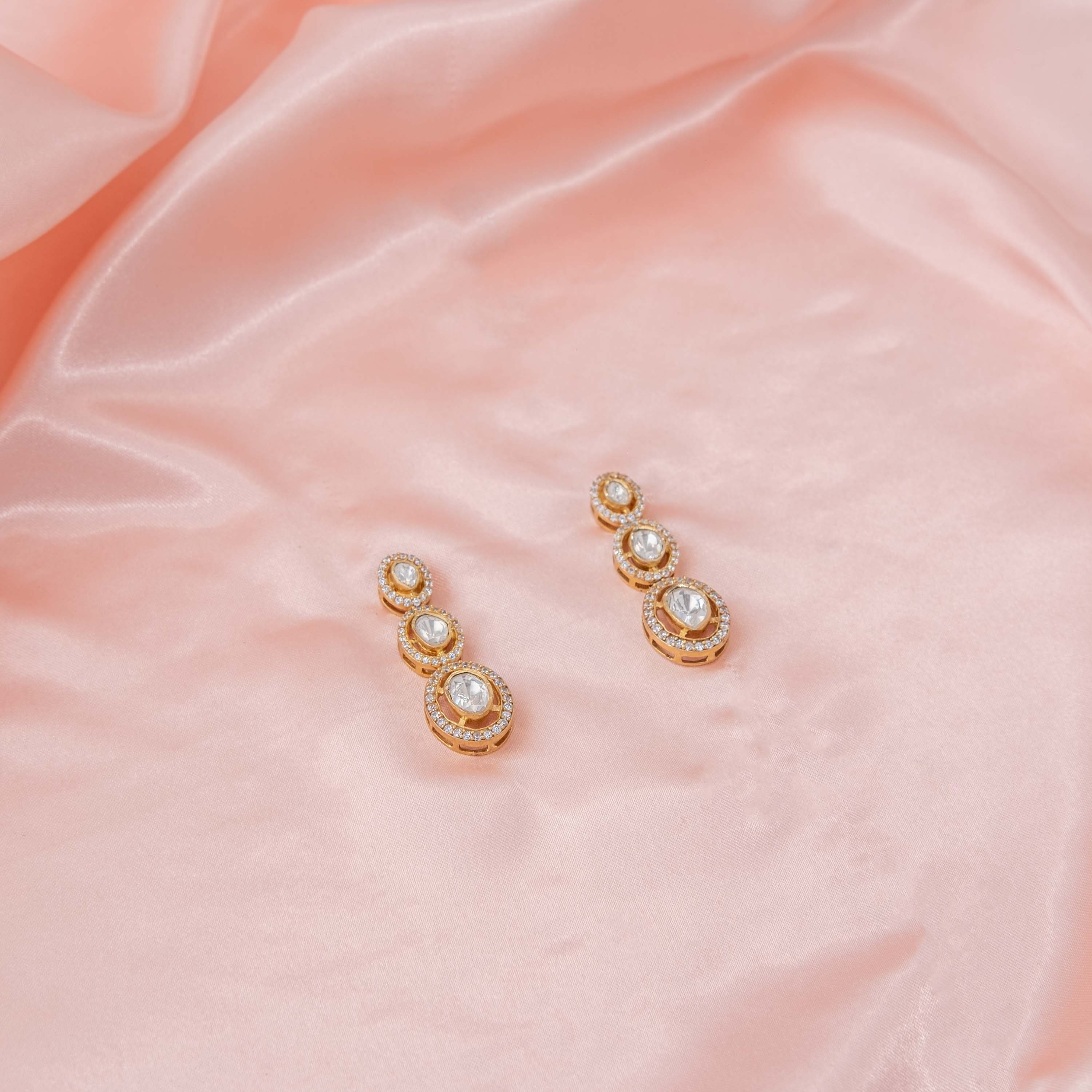 Front view of Kiara Polki Hangings showcasing graduated Moissanite Polki stones with brilliant CZ halo detailing in gold-plated 925 silver