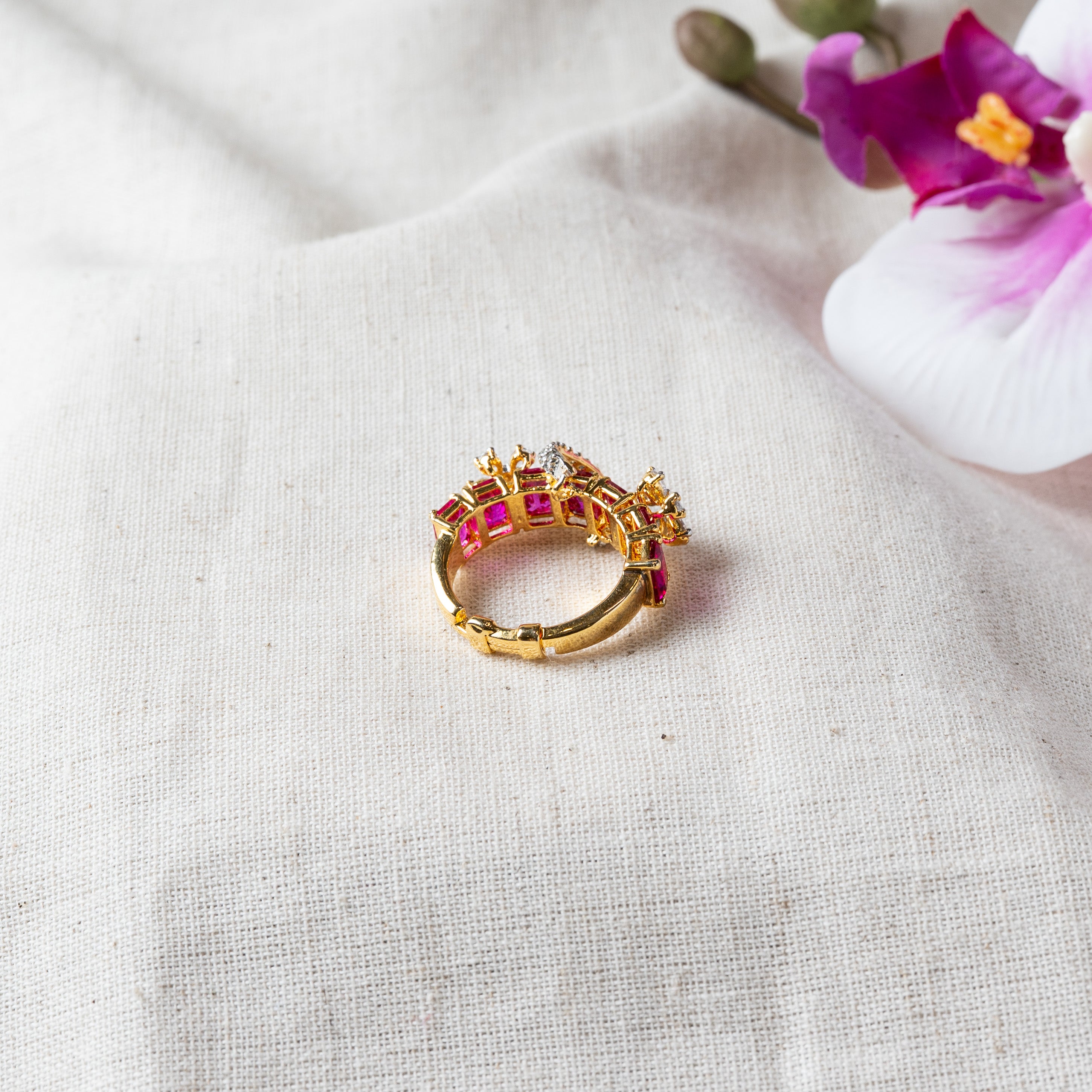 Side view showing the open adjustable shank below the ruby and CZ rows, gold plated 925 silver