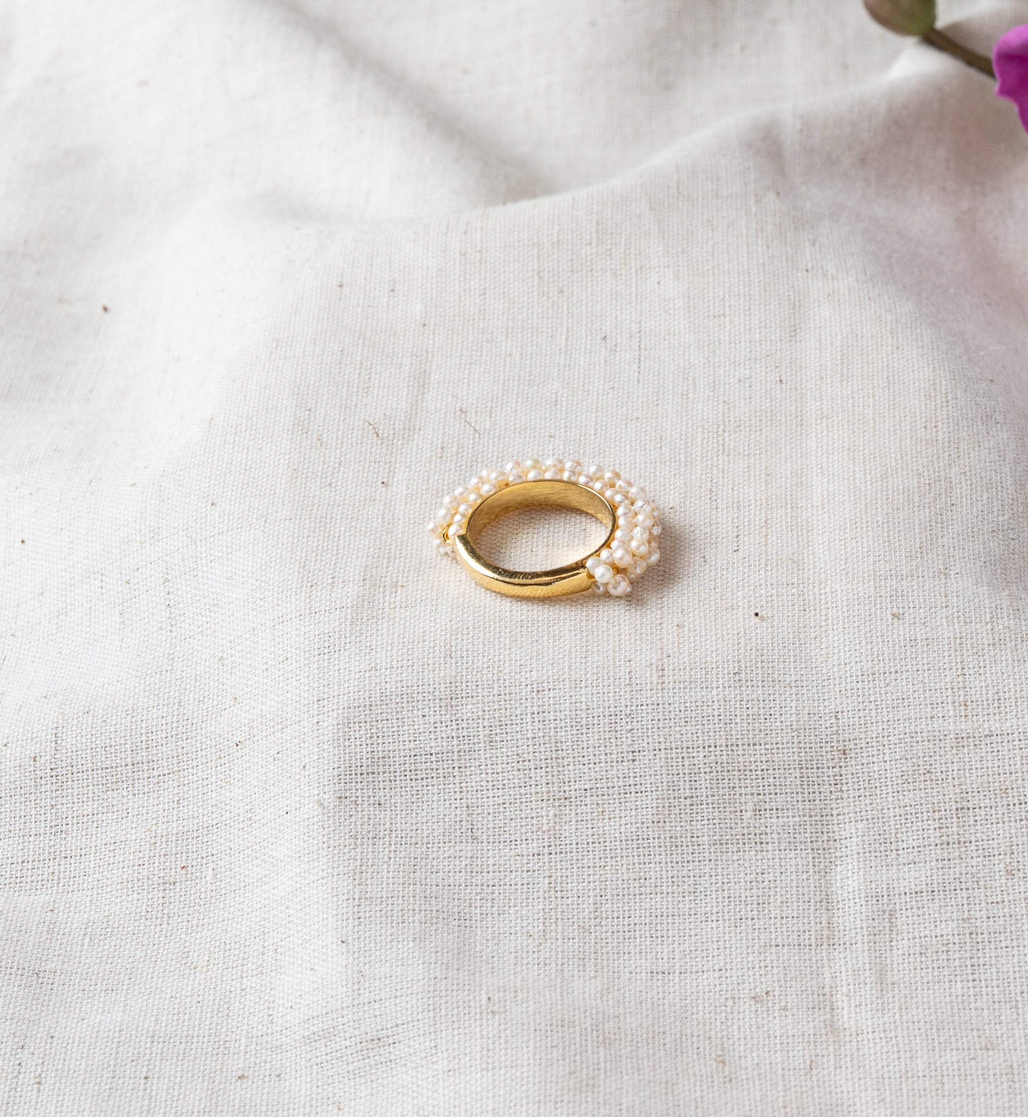 Angled view of the open adjustable shank behind the pearl cluster in gold plated 925 silver