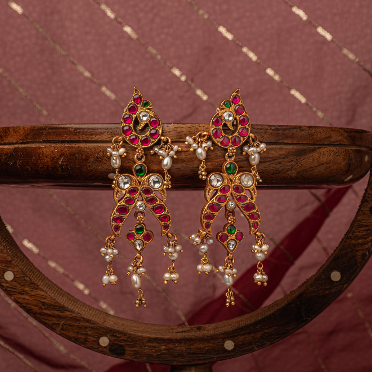 Pearl tassels falling from the paisley kundan frame, antique gold finish 925 silver