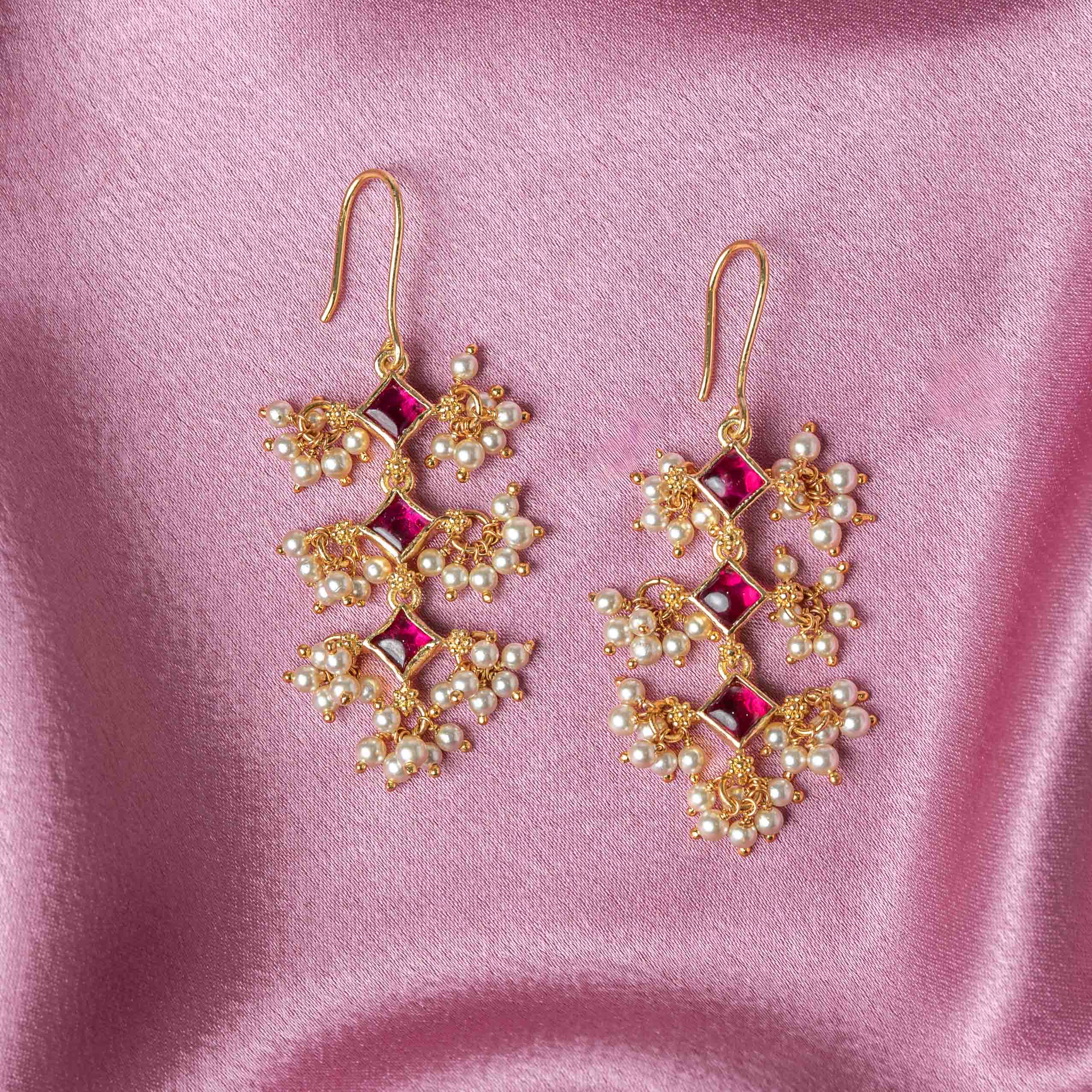 Ruchira CZ Hangings in 925 sterling silver with gold plating, emerald stones, CZ diamonds and Swarovski pearl drops