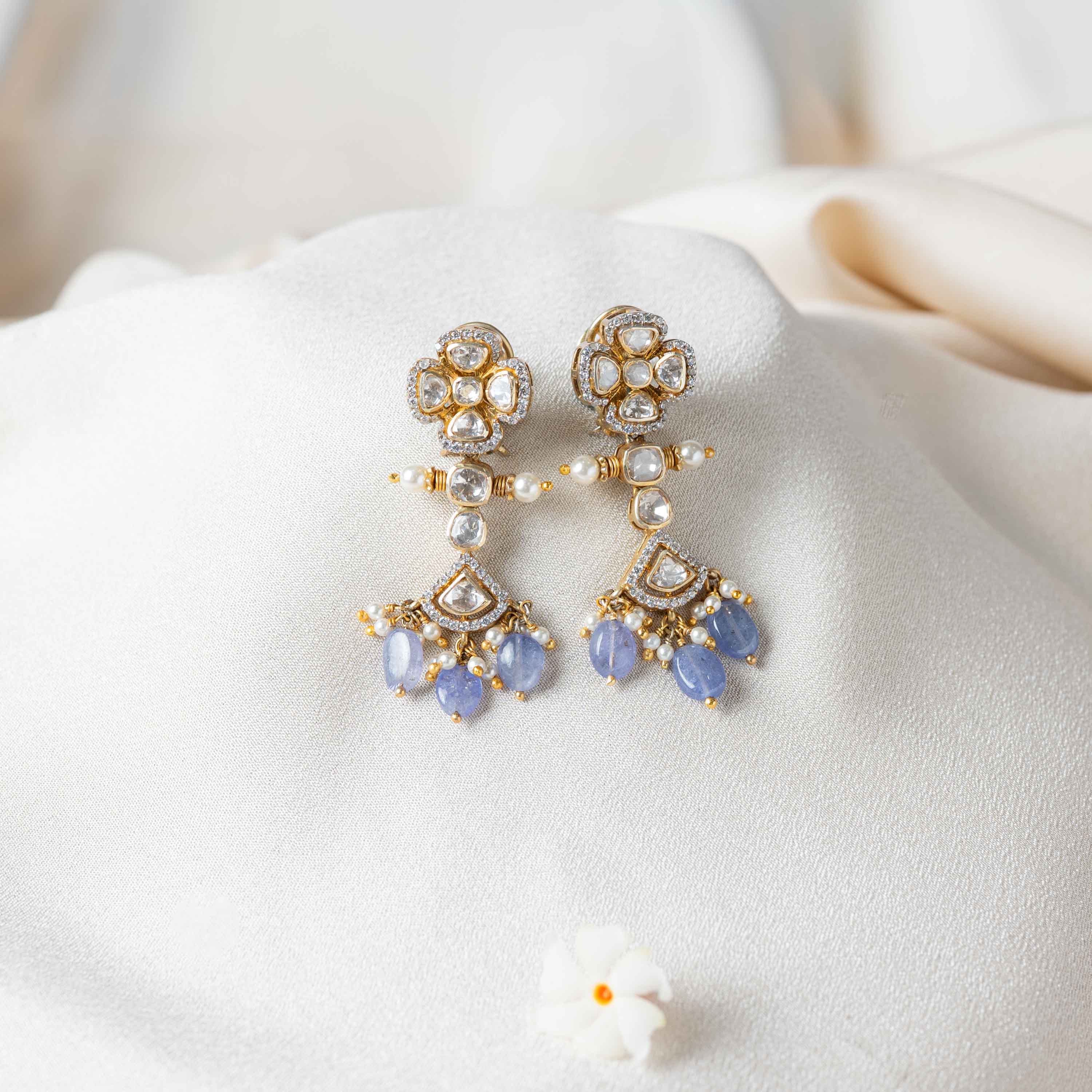 Niya Polki Hangings in 925 sterling silver with gold plating featuring Moissanite Polki floral studs, CZ stones, pearls and strawberry bead drops.