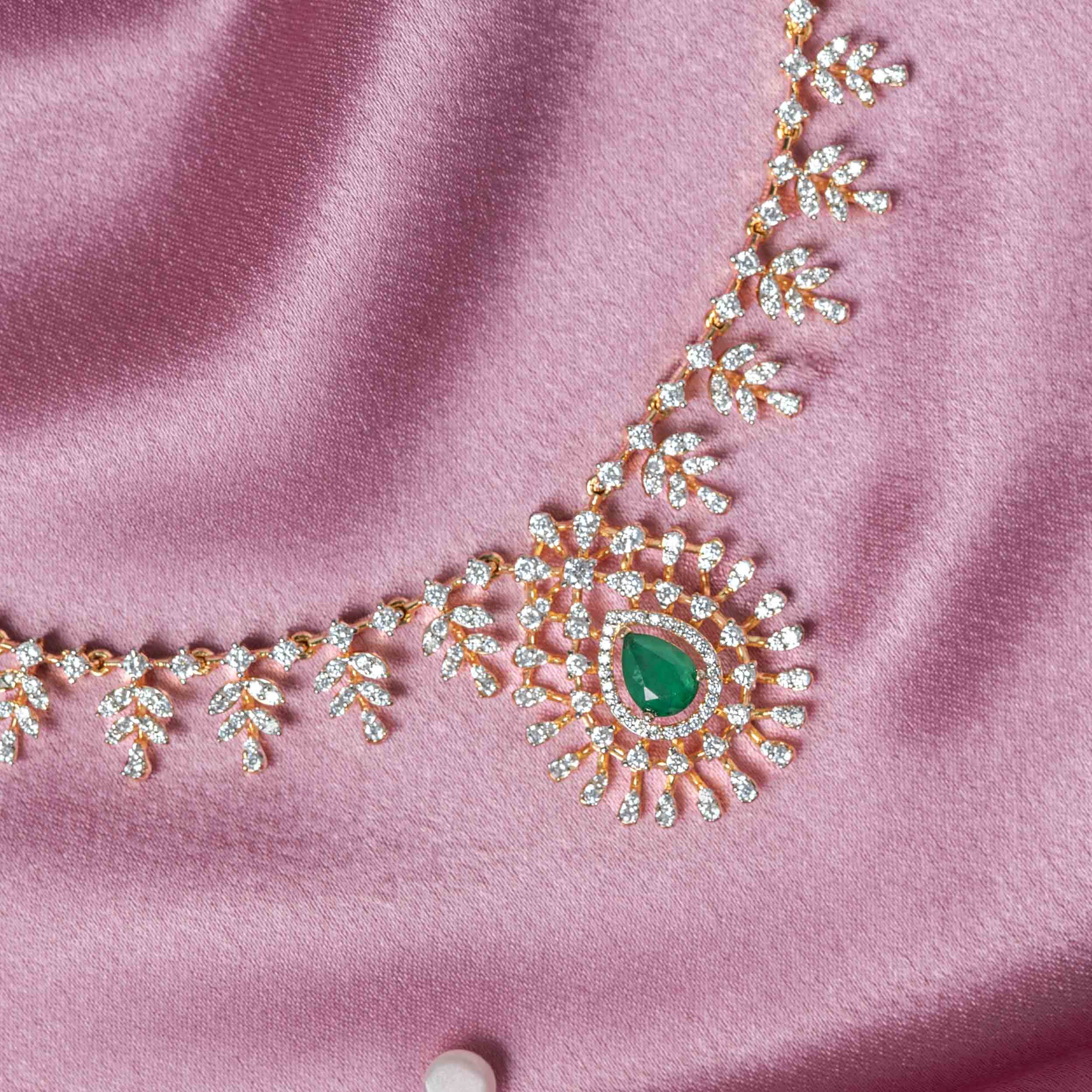 Close-up of Eshna CZ necklace in 925 sterling silver with gold plating featuring green onyx centerpiece and sparkling CZ stones