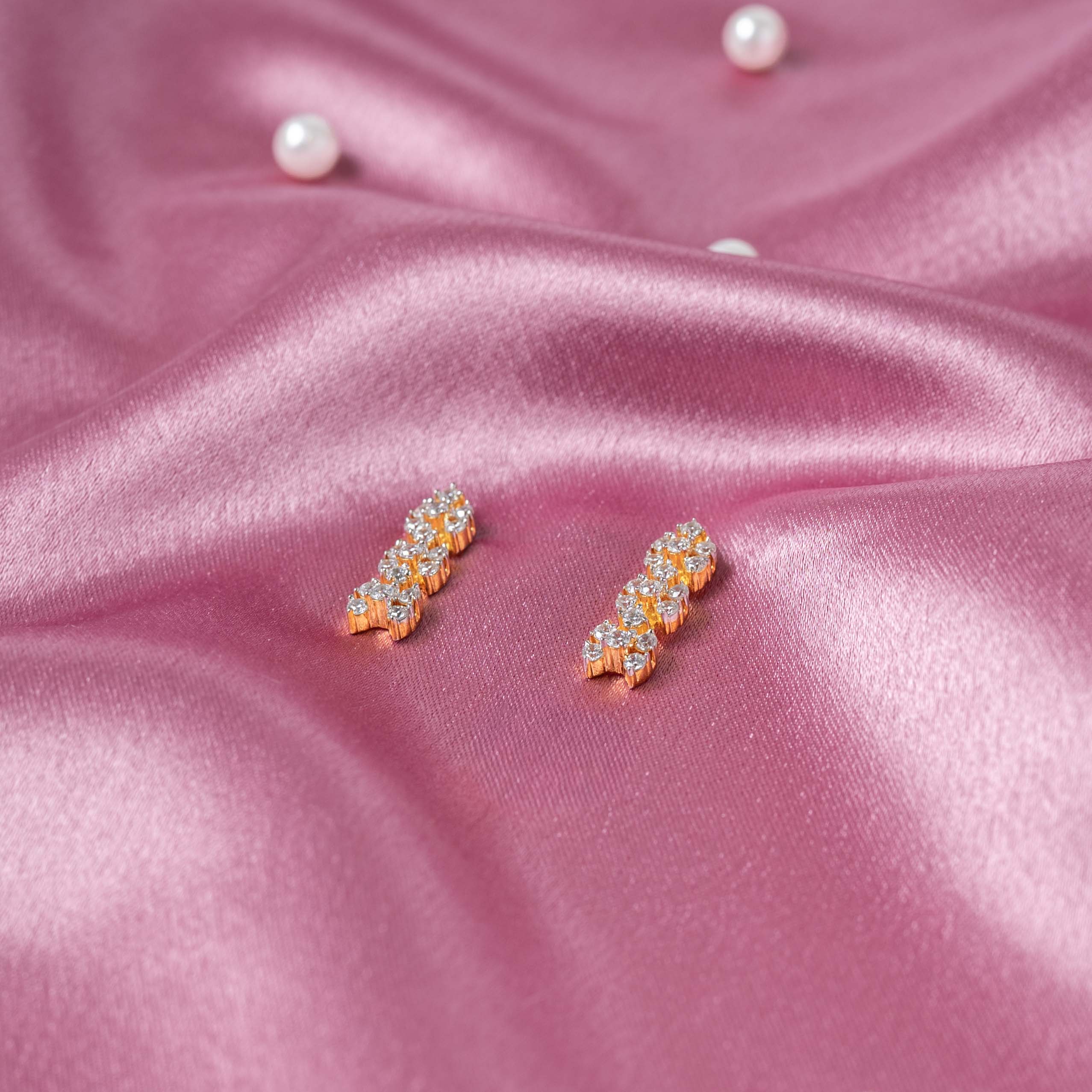 Drop earrings with three articulated CZ paved floral clusters in gold plated 925 silver