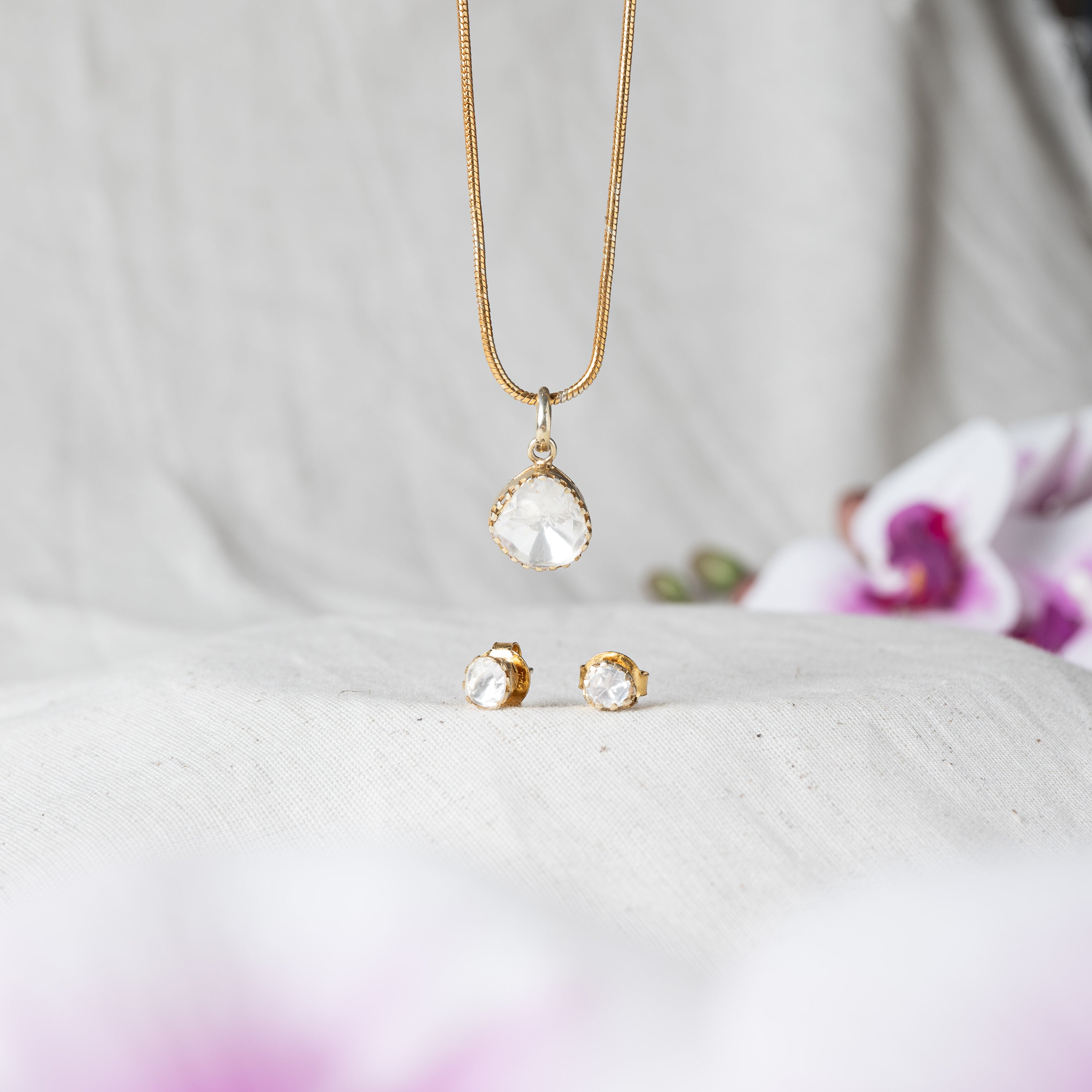 Polki solitaire studs in plain bezels shown with push backs, gold plated 925 silver