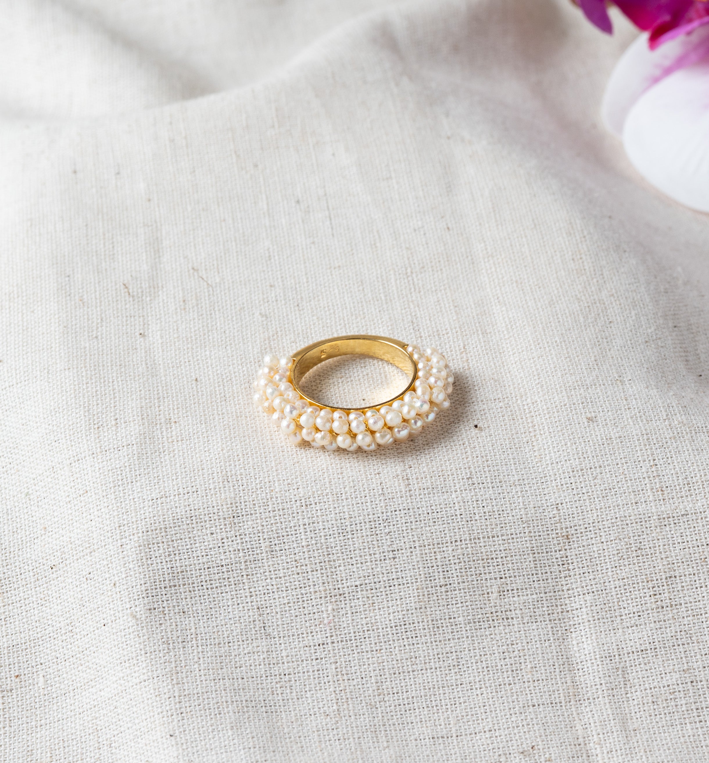 Woven cluster ring of freshwater pearls in gold plated 925 silver with an open adjustable band