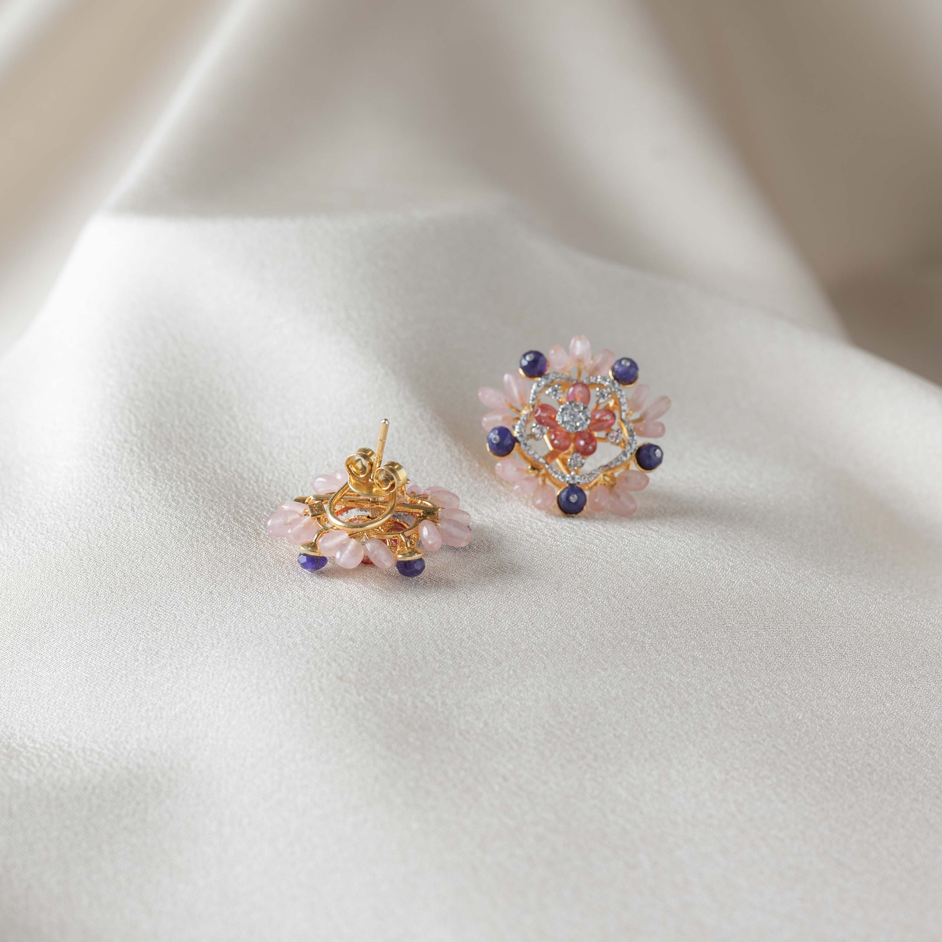 Side view of Peonia CZ floral stud earrings in 925 sterling silver with gold plating and strawberry beads