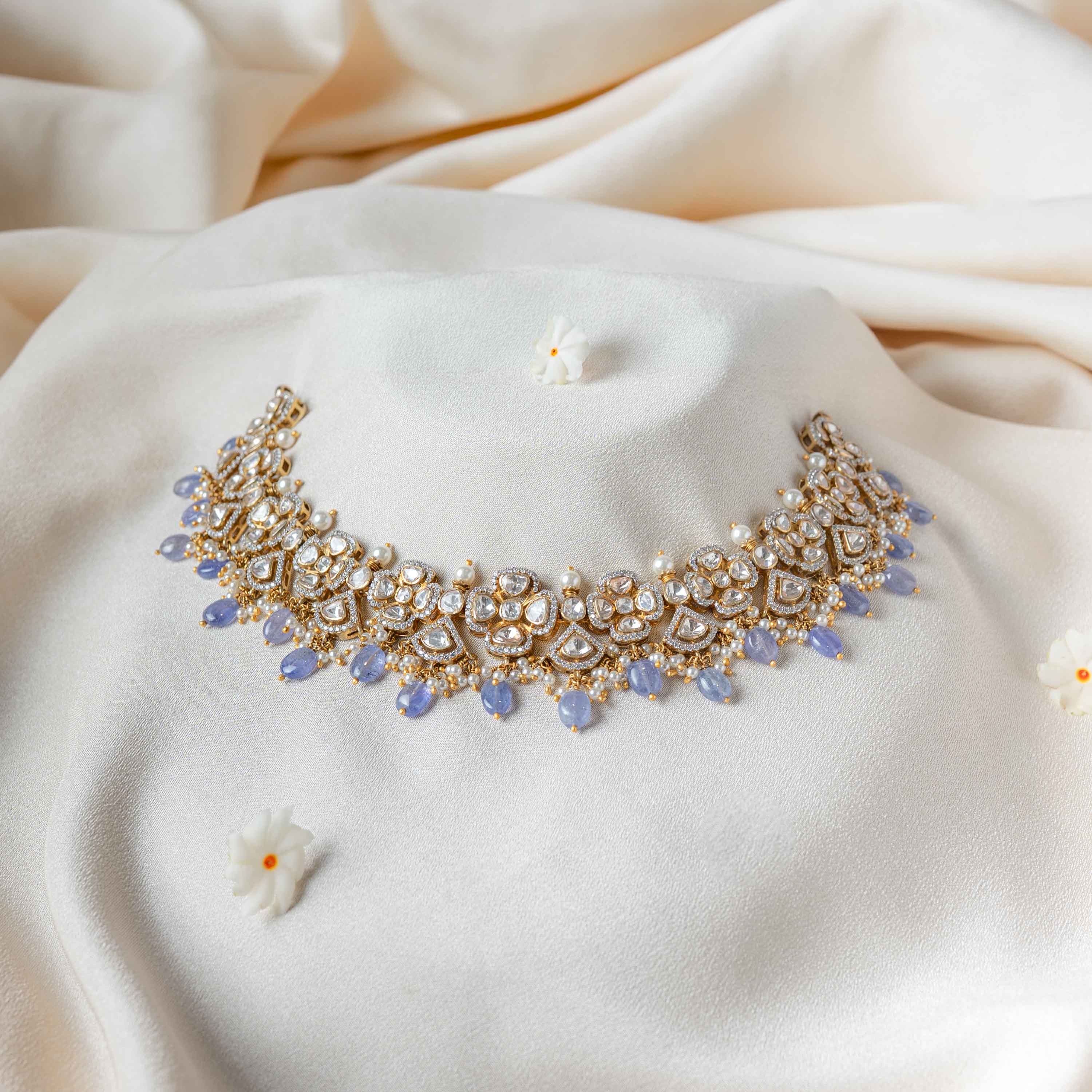 Niya Polki Necklace in 925 sterling silver with gold plating featuring Moissanite Polki stones, sparkling CZ, pearls and strawberry bead fringe for wedding and festive wear.
