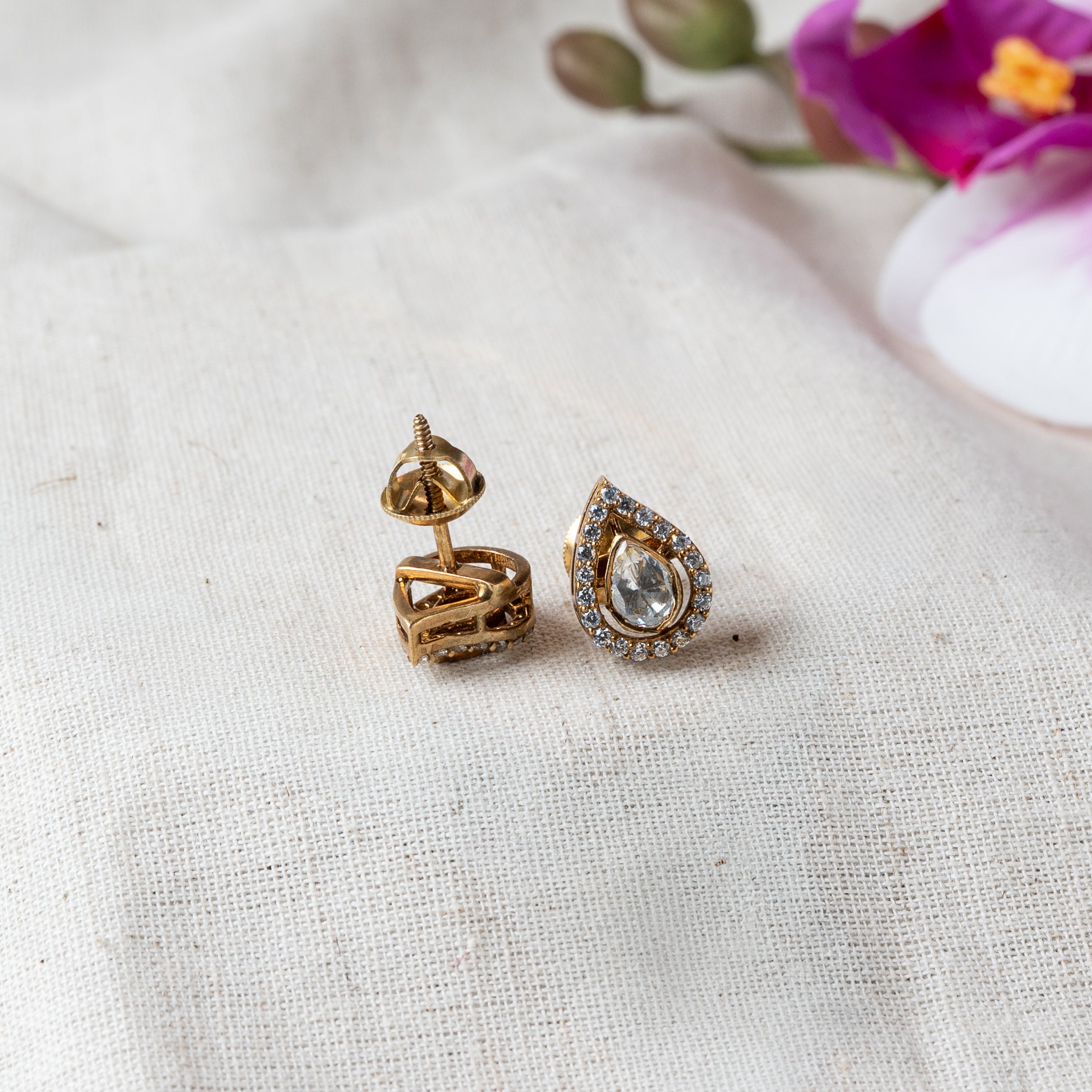 Close crop of the studs, one turned to show the screw back, teardrop CZ halo in Victorian plated 925 silver