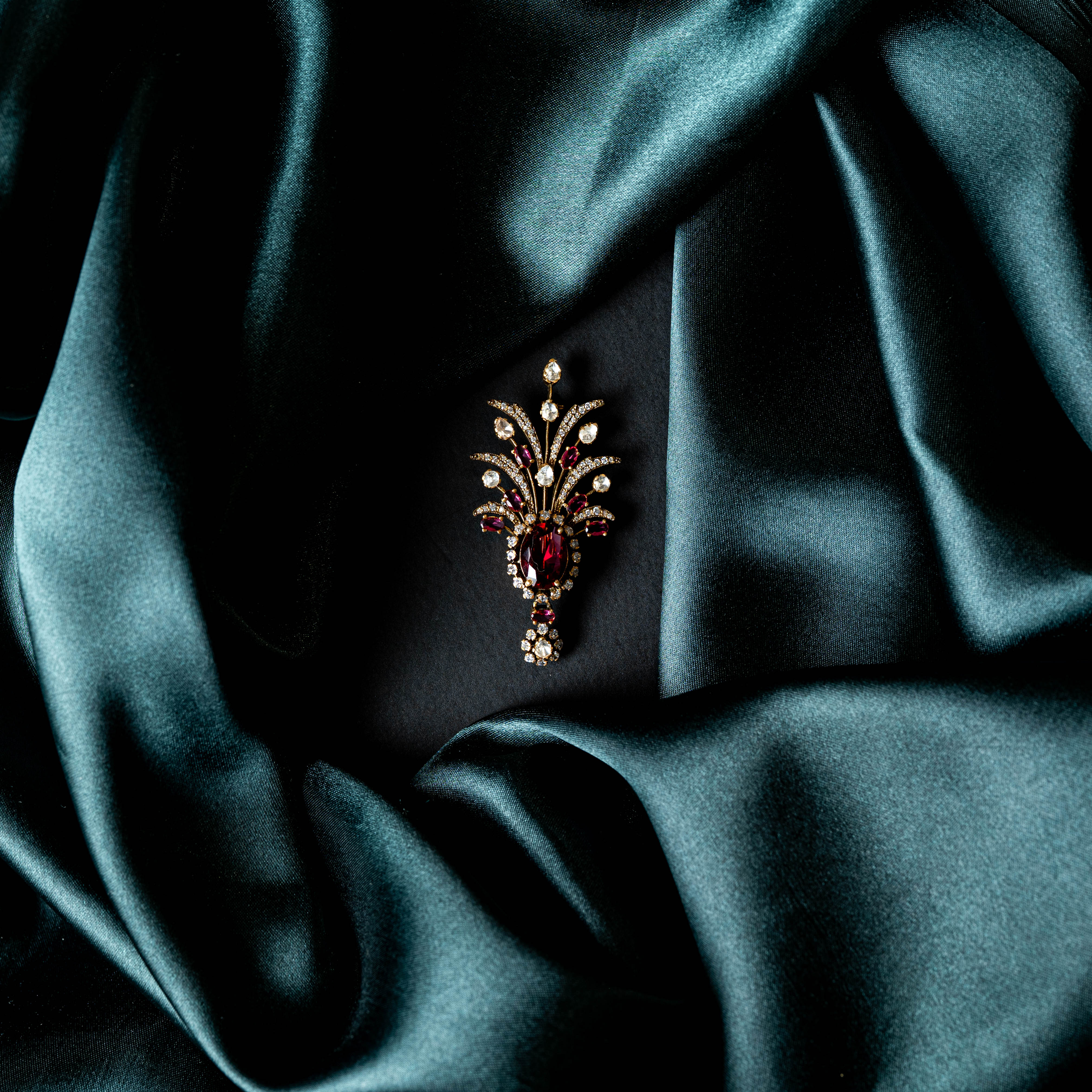 Back of the ruby brooch showing the gold toned reverse and pin fitting
