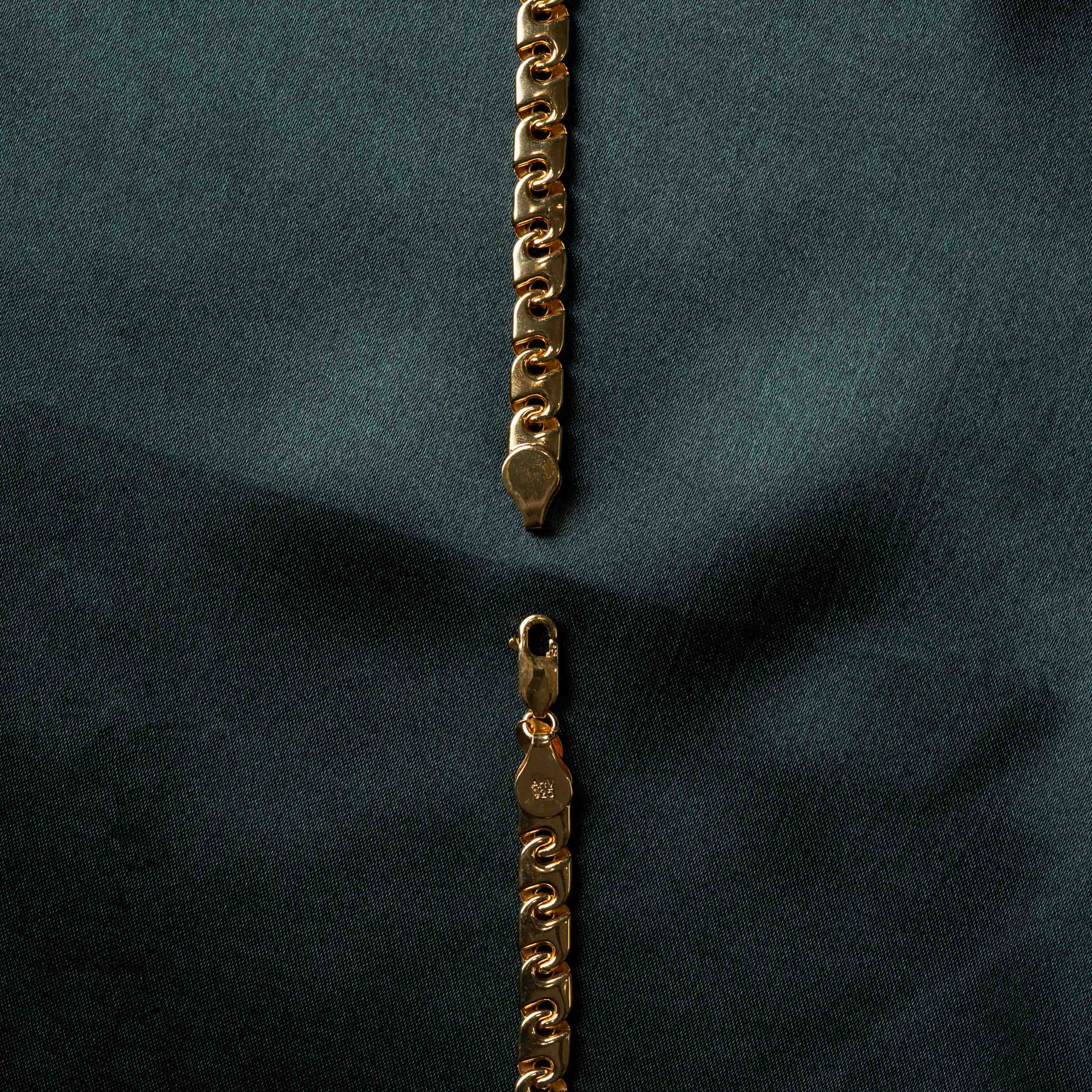 Close crop of the lobster clasp and scroll links, gold plated 925 silver