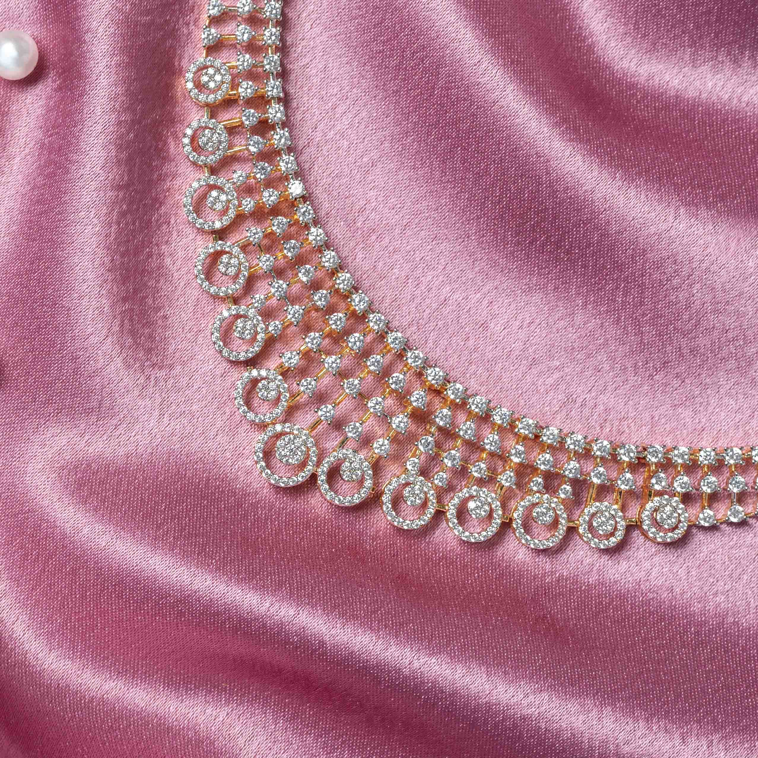Detail of three rows of white CZ clusters linked edge to edge in 925 silver