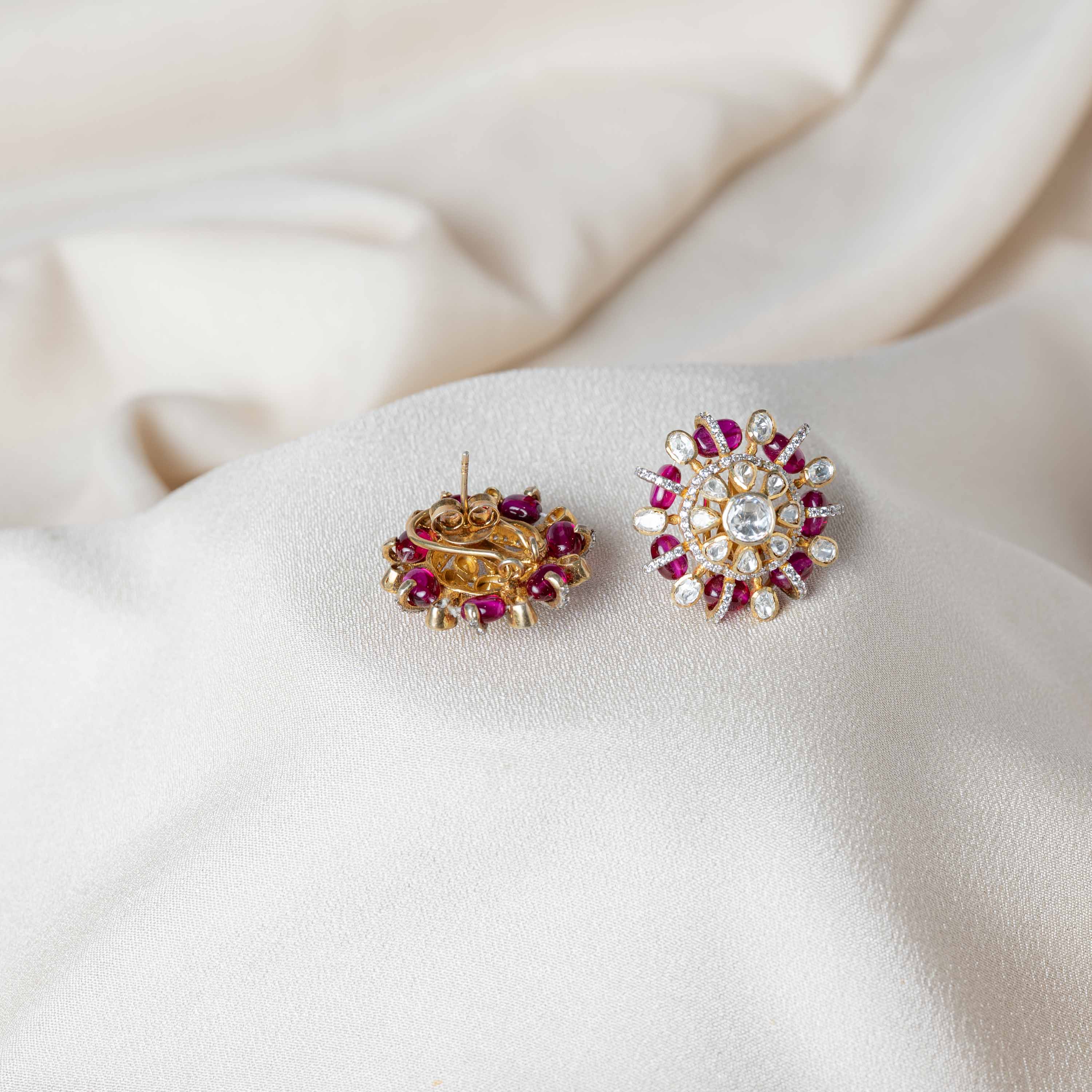 Close-up of Heliora CZ stud earrings crafted in 925 sterling silver with gold plating, floral Polki design and sparkling CZ detailing