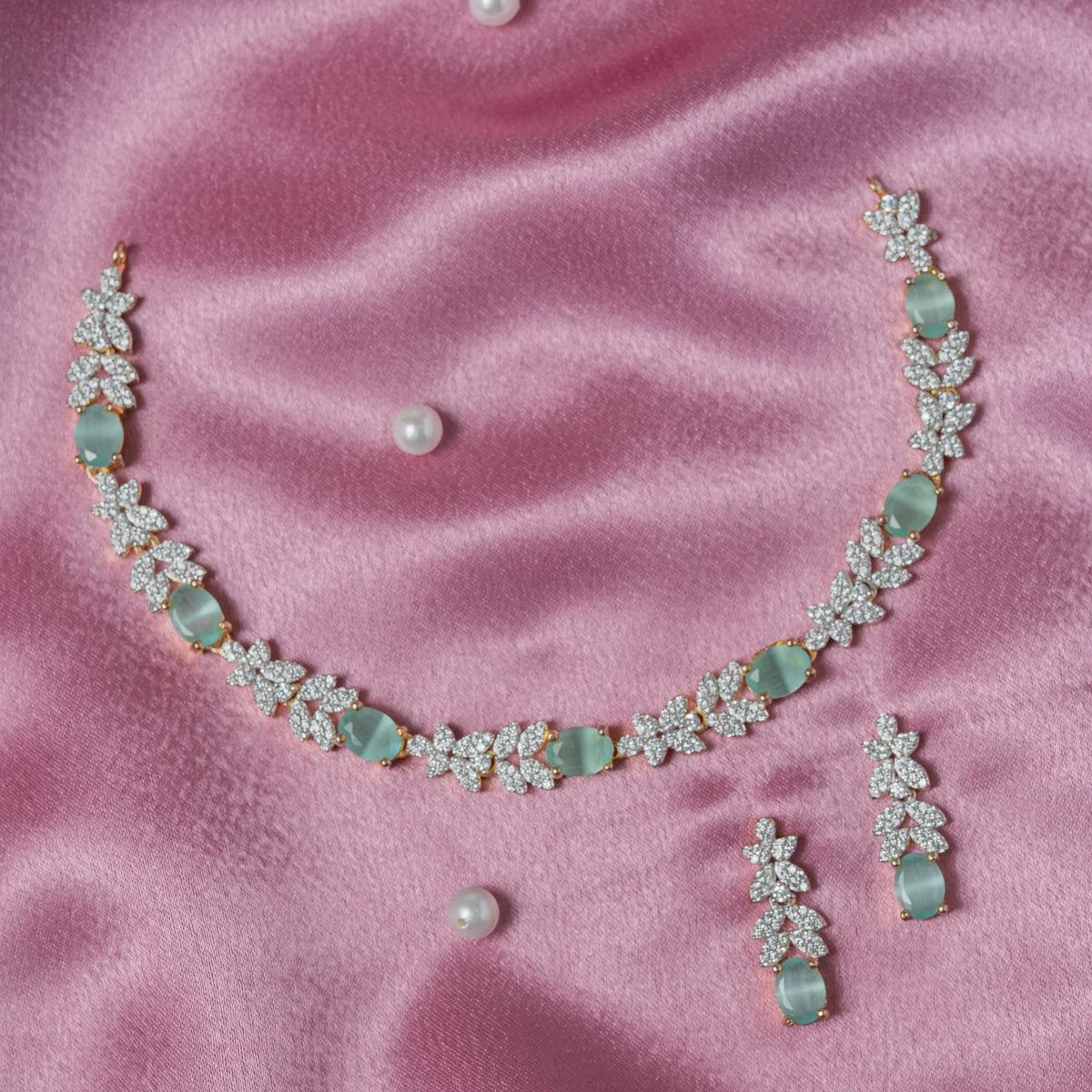 Close view of the push back post behind the green stone leaf earring in 925 silver