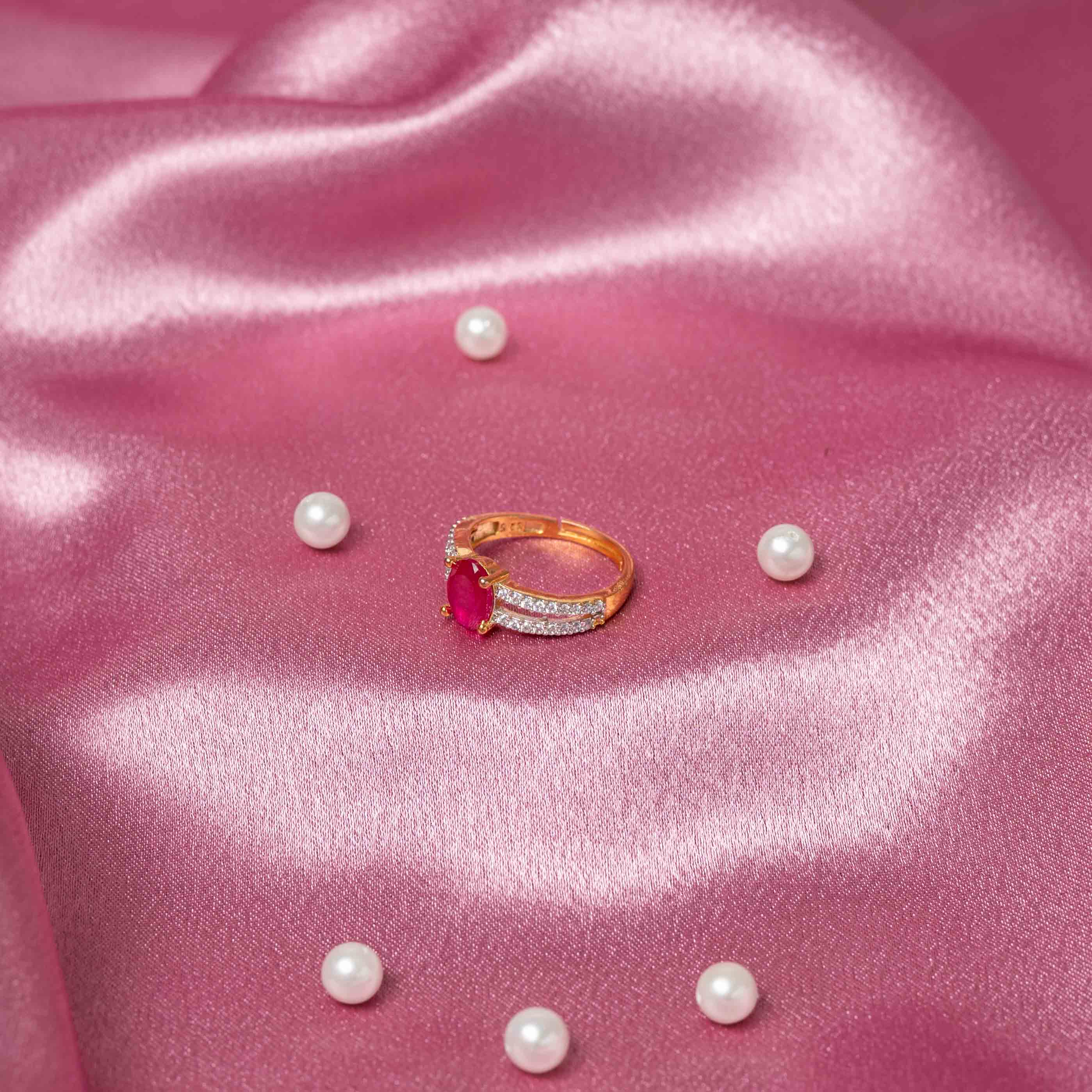 Top view of Vanya CZ ring featuring a red gemstone, pavé CZ stones and handcrafted 925 silver with gold plating