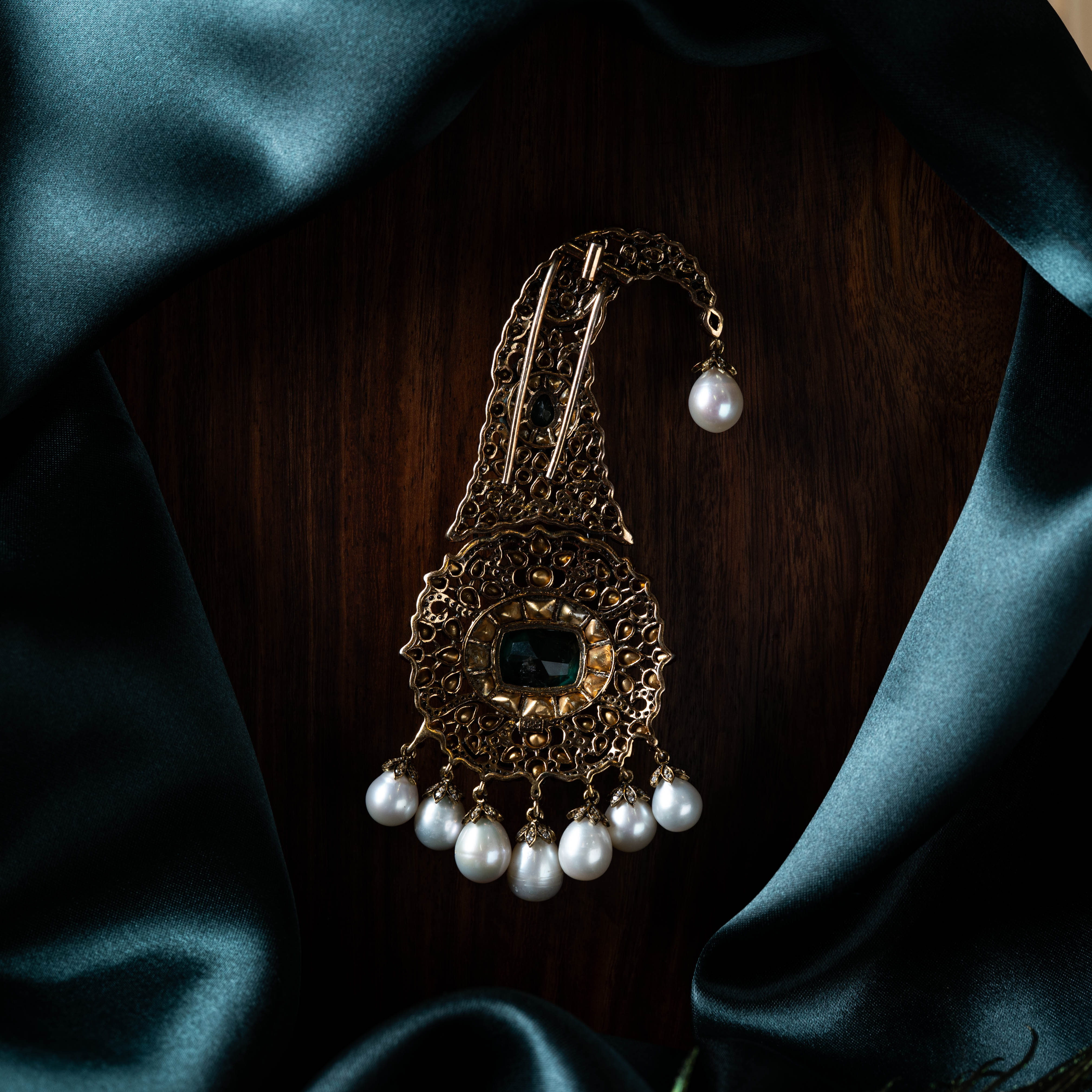 Kalangi with a rectangular emerald centre, CZ pave and hanging pearl drops in victorian plated 925 silver