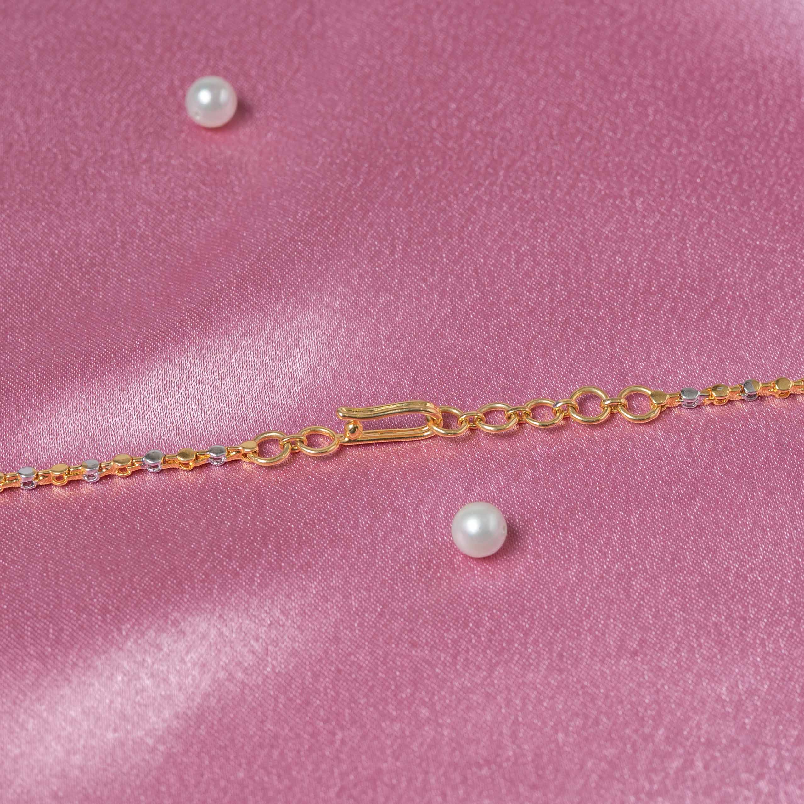 Close crop of the hexagonal CZ pendant hanging from the stone dotted gold plated chain