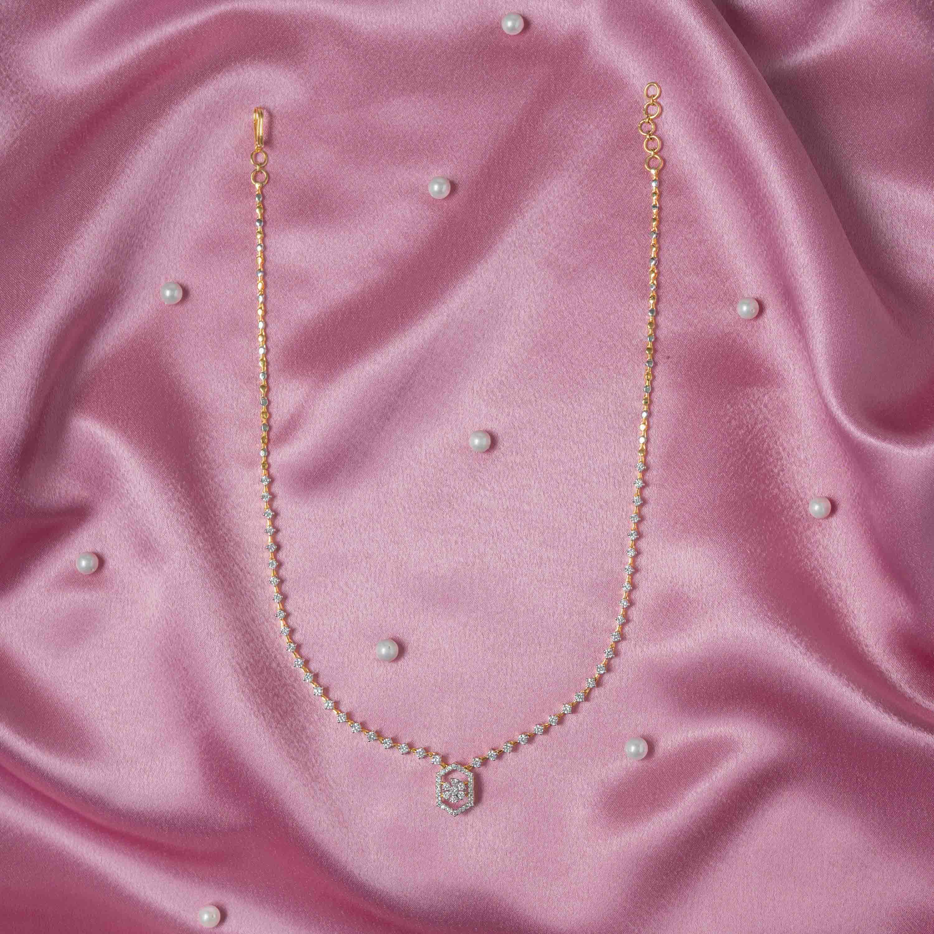 Necklace shown with its matching hexagonal CZ drop earrings in gold plated 925 silver