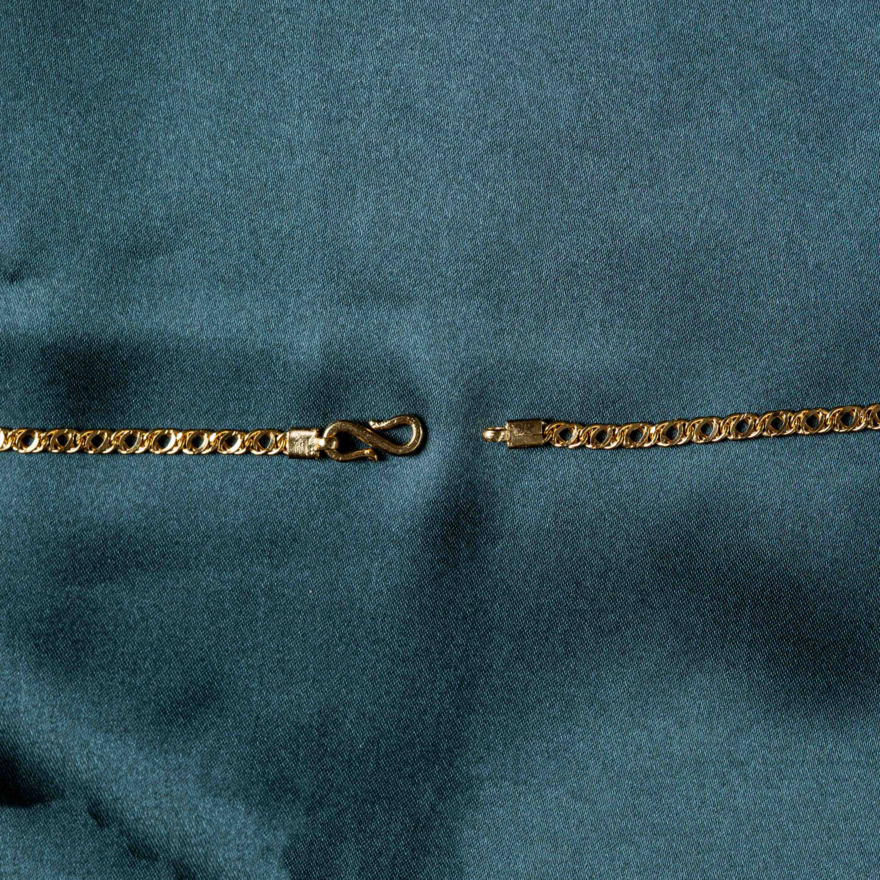 Close crop of the S hook clasp and openwork links, gold plated 925 silver