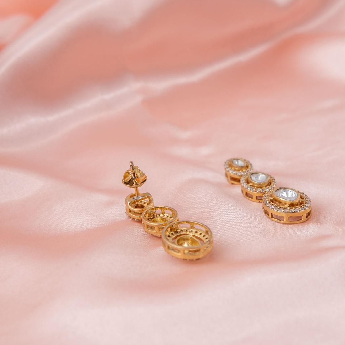 Bombay screw back fitting behind the graduated polki drop earring, gold plated 925 silver